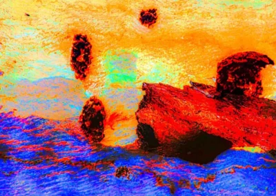 Abstract digital artwork showcasing vibrant colors of orange, blue, and red with blurred shapes resembling rocks against a colorful backdrop